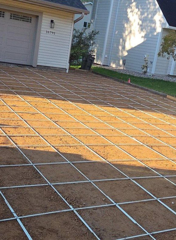 Driveway preparation with fiberglass rebar grid